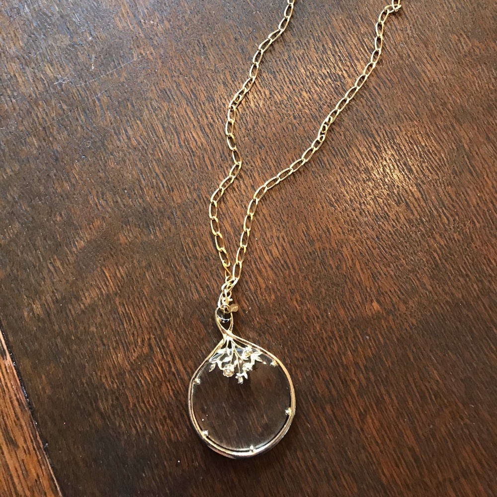 Necklace with magnifying glass